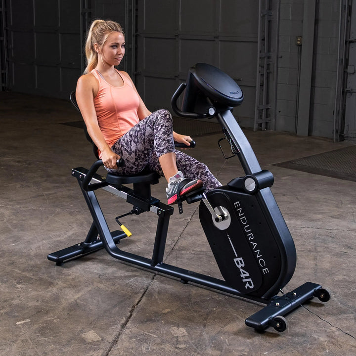 woman workout on Body Solid Endurance Commercial Recumbent Bike B4RB
