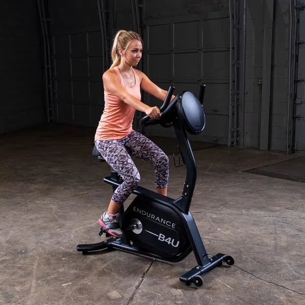 woman riding the Endurance Commercial Upright Bike B4UB