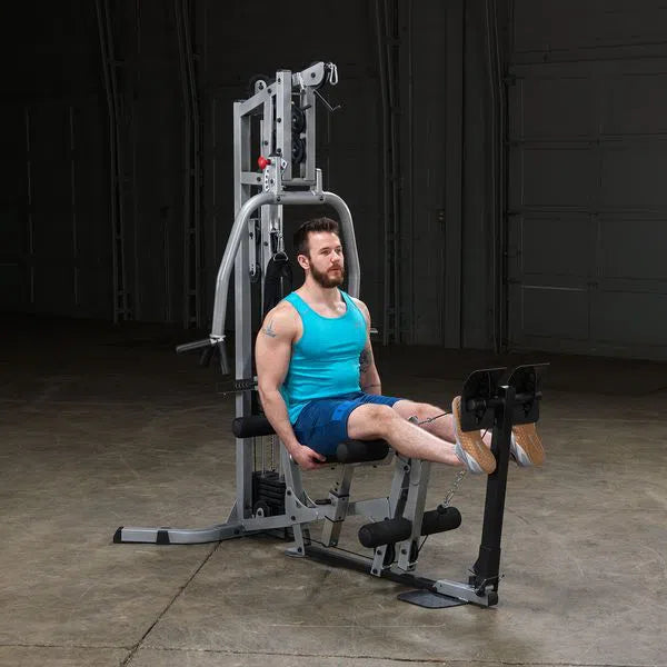 man doing calf presses on the Body-Solid Powerline Home Gym with Leg Press