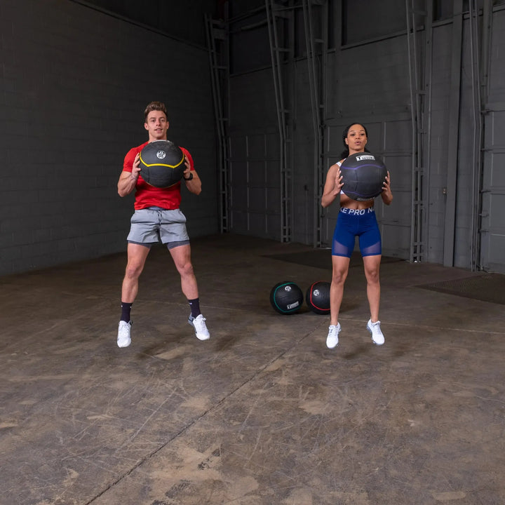 partner jumping workout with Body-Solid Heavy Rubber Balls BSTHRB