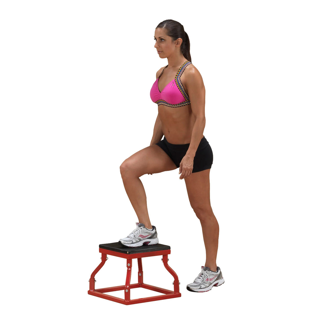 A woman training with the Body-Solid Metal Plyo Box BSTPB 