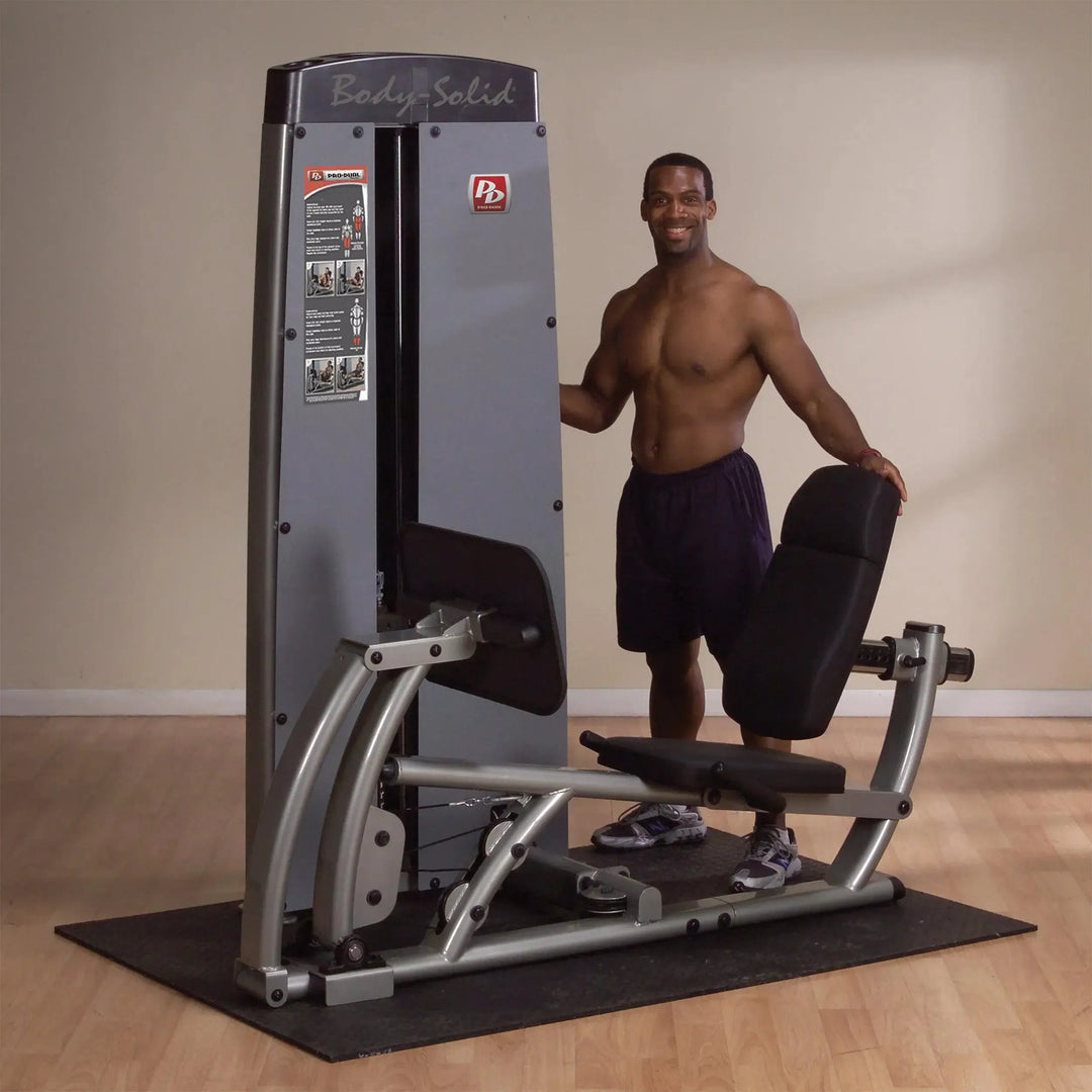 A man showcasing the Body-Solid Leg Press Machine DCLPSF
