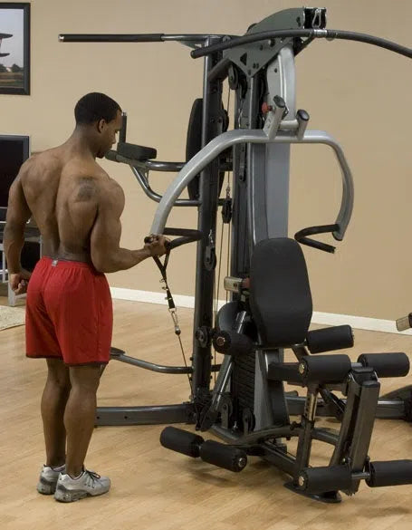 man single arm bicep cable curl workout on Body-Solid Fusion Commercial Exercise Machine F500