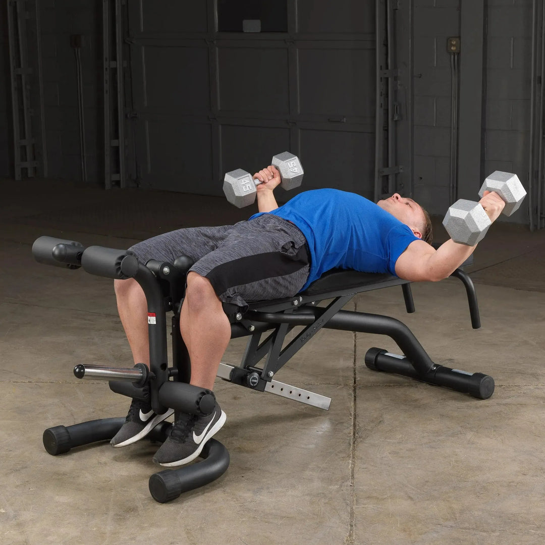 man dumbbell chest fly workout on Body-Solid Adjustable Weight Bench with Leg Extension & Leg Curl FID46