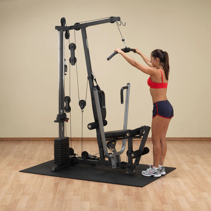 woman standing ad workout on Body-Solid Compact Home Gym G1S