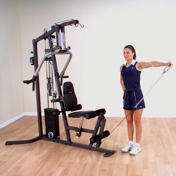 woman single arm lateral raise exercise on Body-Solid All-In-One Gym Machine for Home G3S