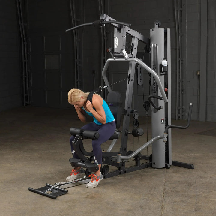 girl ab crunch exercise on Body-Solid Compact Weight Machine G5S