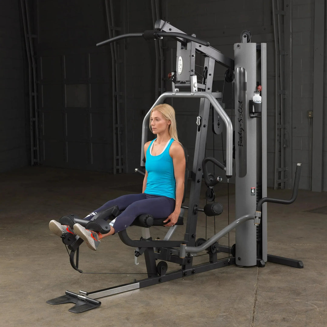 woman leg extension workout on Body-Solid Compact Weight Machine G5S