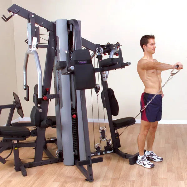 man single arm front raise exercise on Body-Solid Multi-Purpose Gym Machine G9S