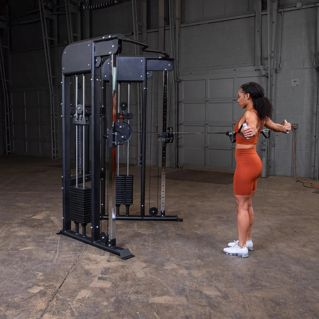 woman back fly exercise on Body-Solid Functional Trainer Machine GFT100 front view