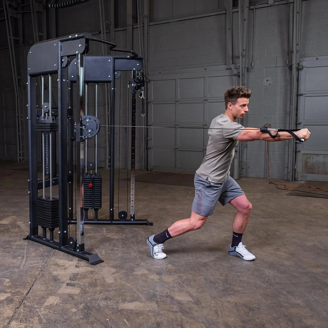 man standing chest press exercise on Body-Solid Functional Trainer Machine GFT100