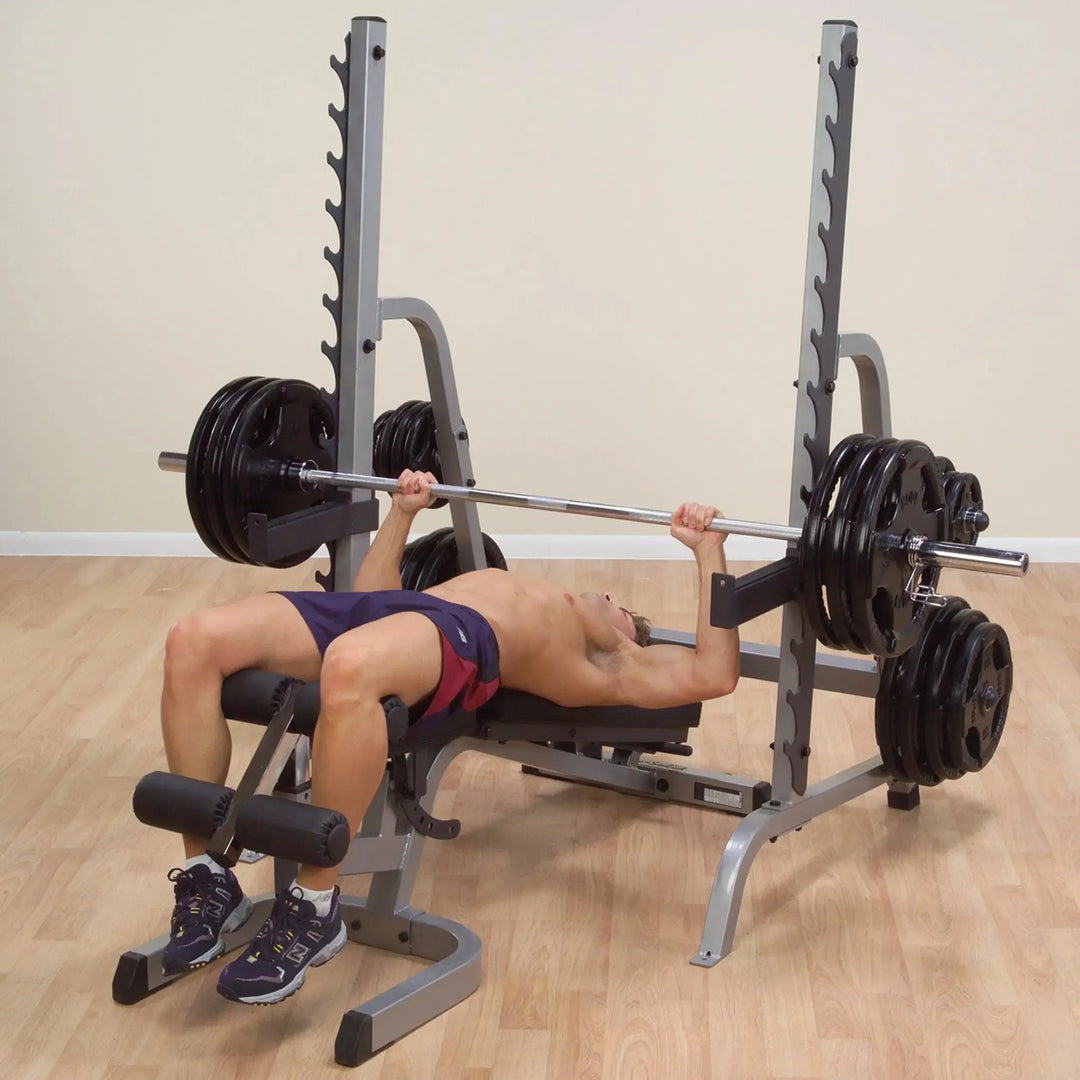 man decline bench press exercise on Body-Solid Squat and Bench Rack GPR370 in a flat, semi-declined position