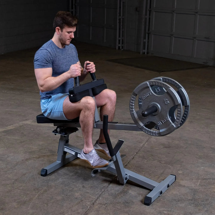 man seated calf raises exercise on Body-Solid Calf Raise Machine GSCR349