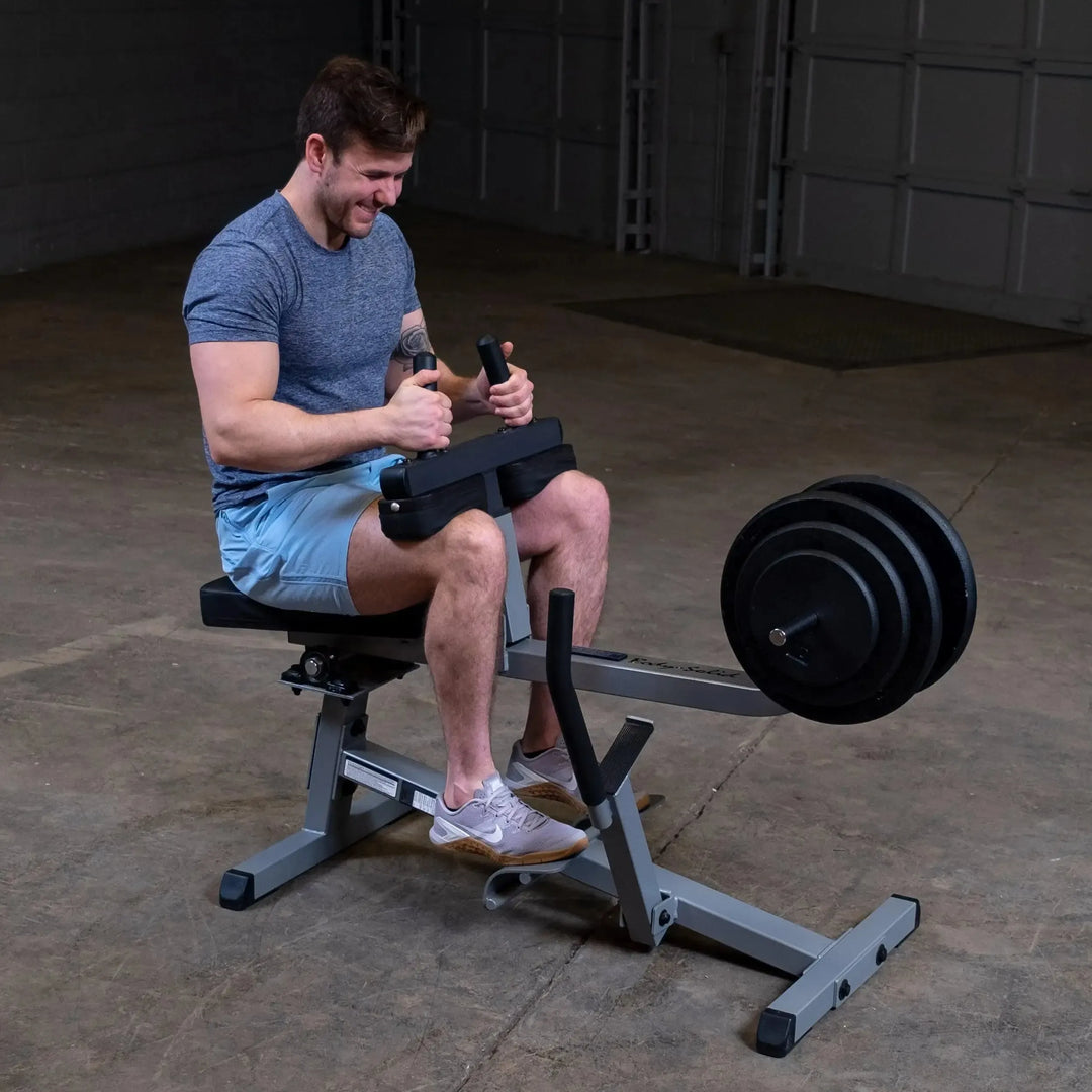 A man training on the Body-Solid Calf Raise Machine GSCR349