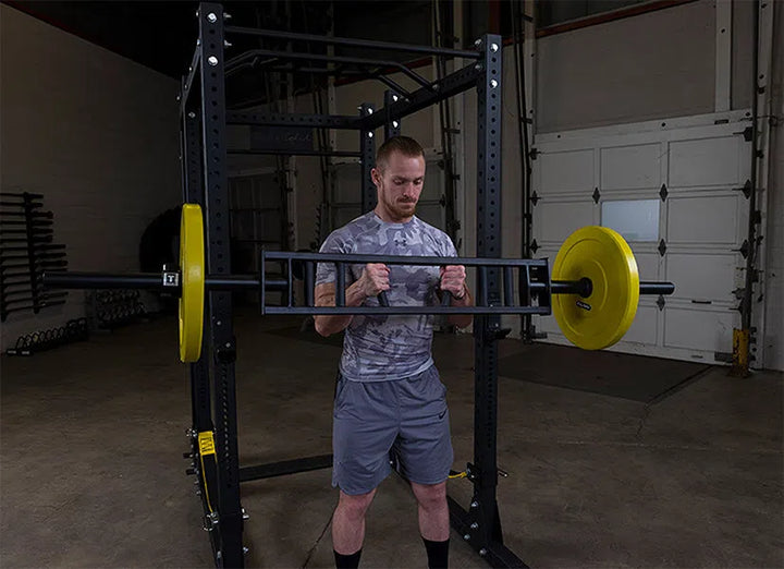 man bicep curls with Body-Solid Multi Grip Bench Press Bar OMG86