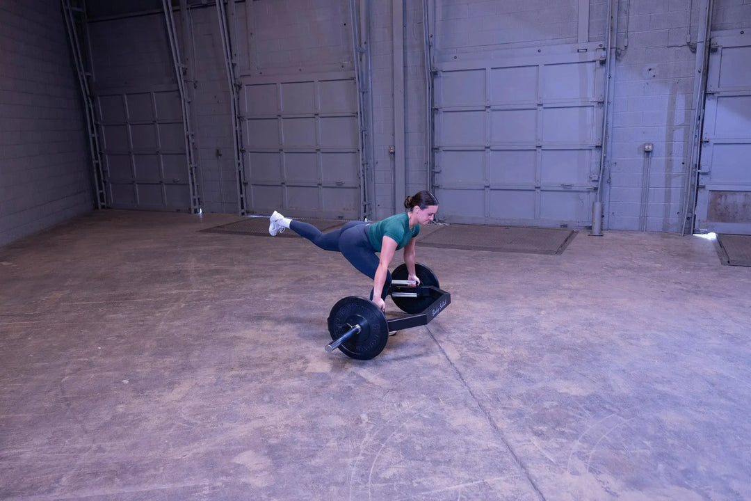 A woman training on the Body-Solid Open Trap Bar OTB100