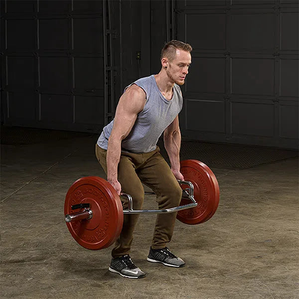 A man training with the Body-Solid High Handle Trap Bar OTB50RH