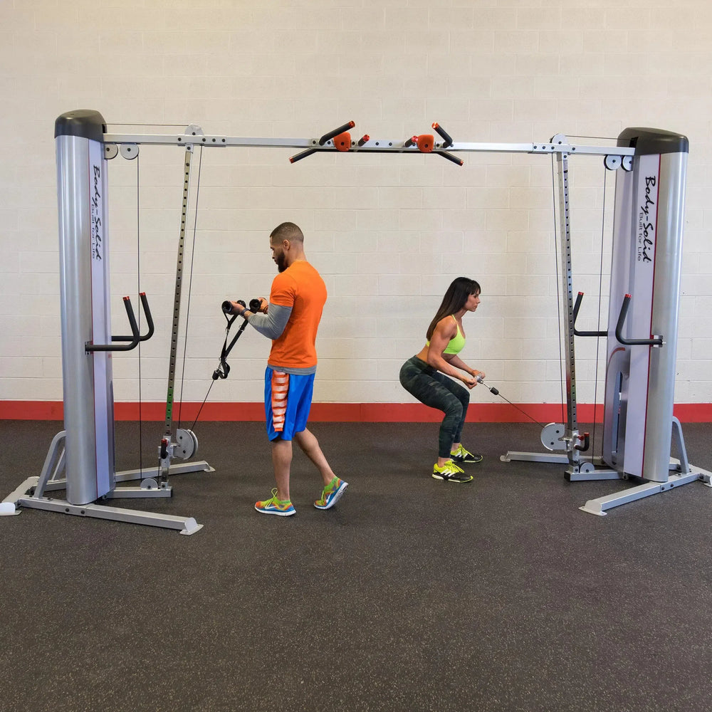 two people cable crossover workout on Body-Solid Commercial Cable Crossover Machine S2CCO