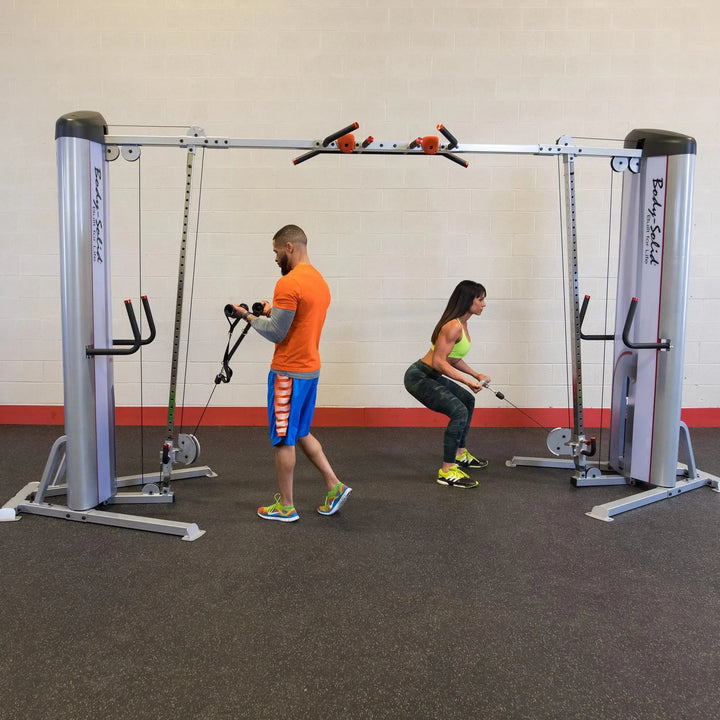 two people cable crossover workout on Body-Solid Commercial Cable Crossover Machine S2CCO