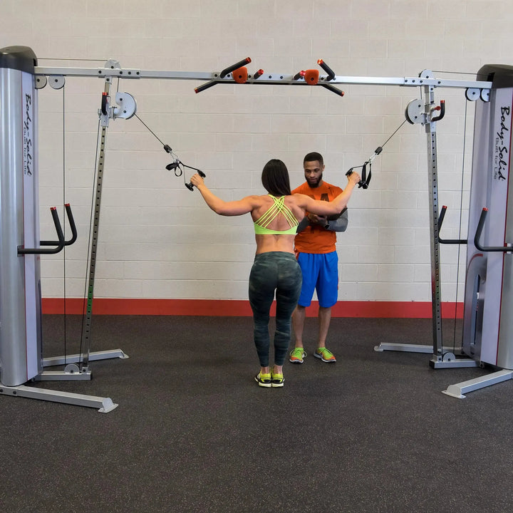 couple training on Body-Solid Commercial Cable Crossover Machine S2CCO