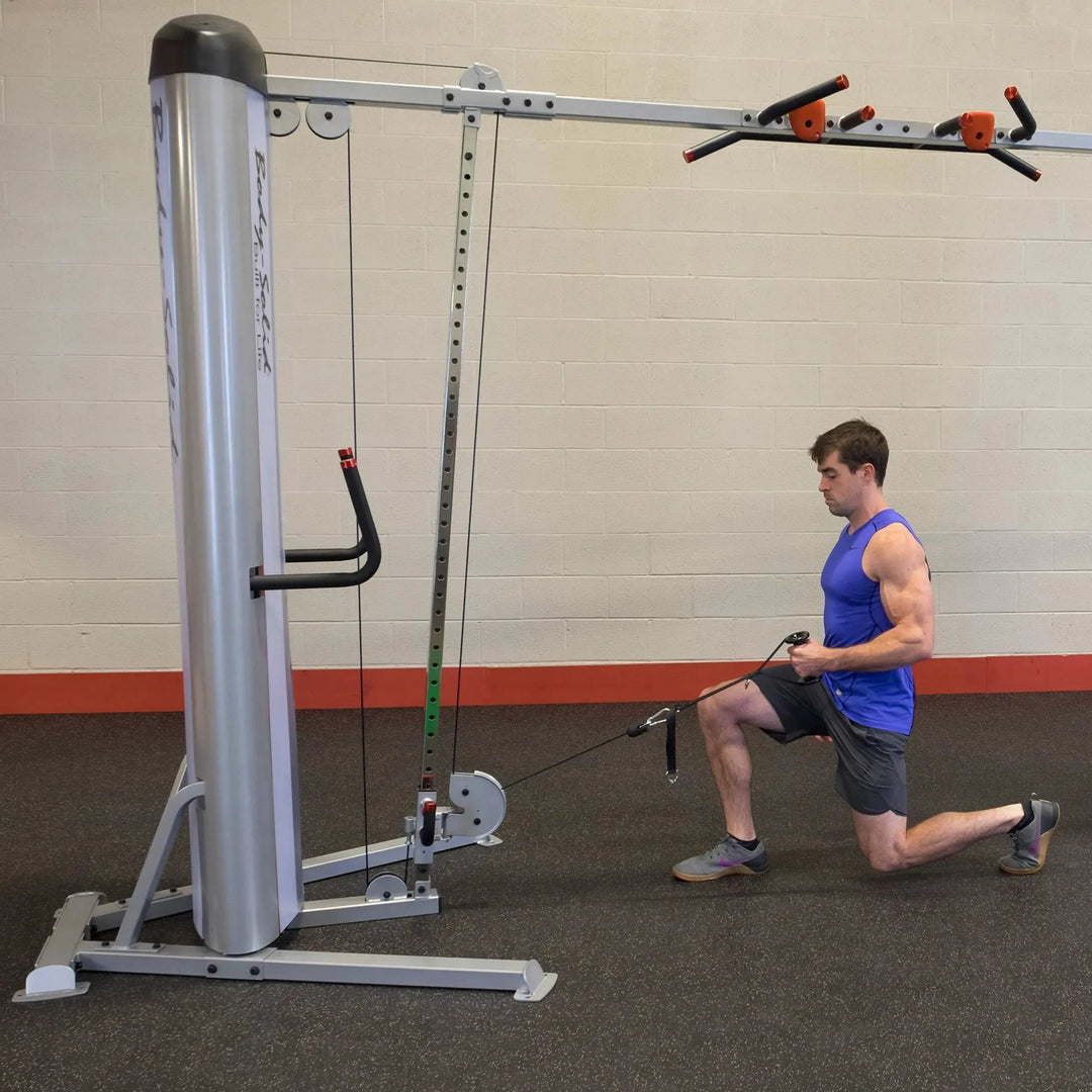 man kneeling cable row on Body-Solid Commercial Cable Crossover Machine S2CCO