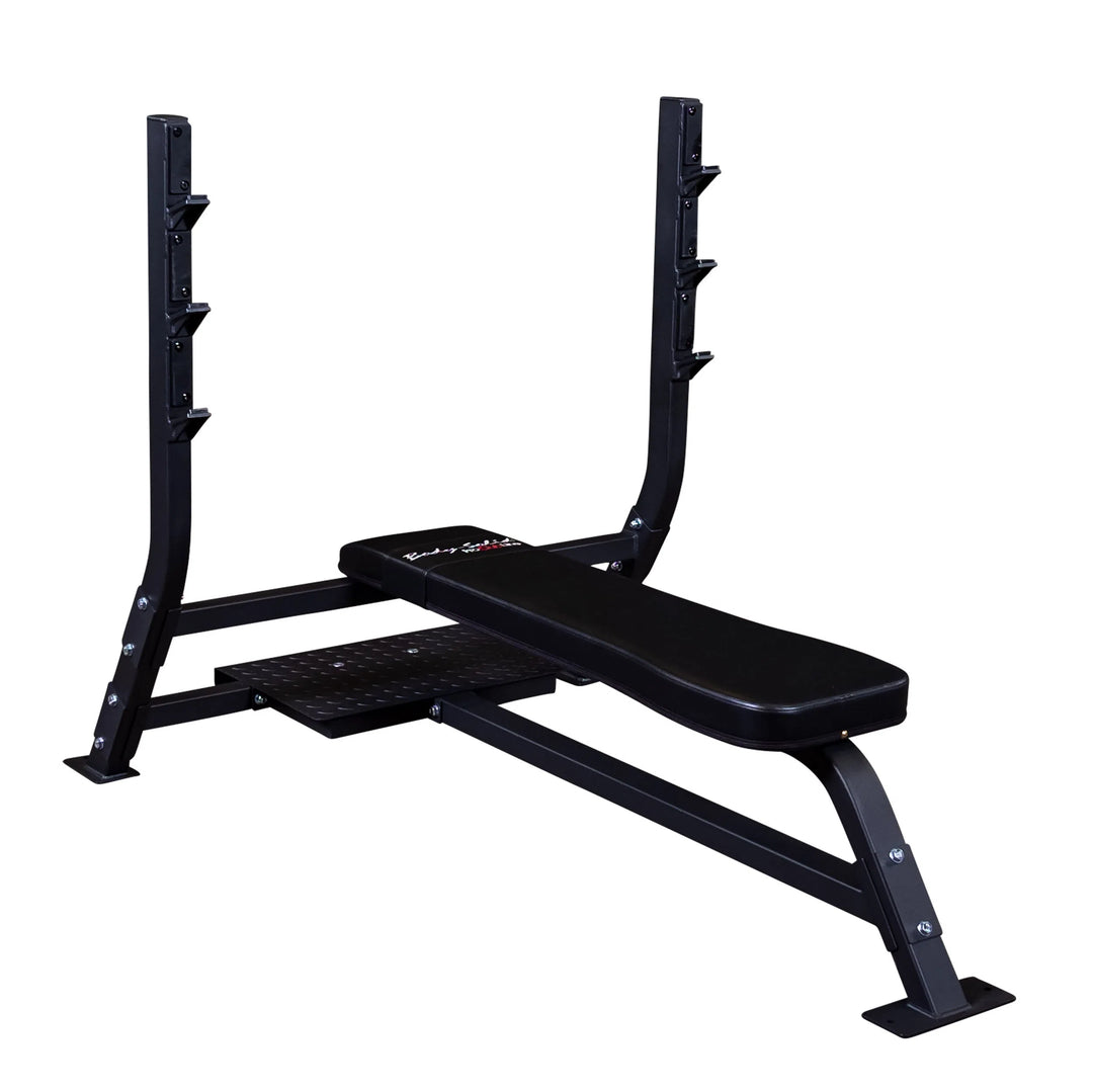 The Body-Solid Pro Clubline Olympic Flat Bench (SOFB250) by Body-Solid Pro Clubline is ideal gym equipment for any fitness facility. It features a padded bench on metal legs and an attached squat rack with multiple weight hooks, making it perfect for strength training sessions.