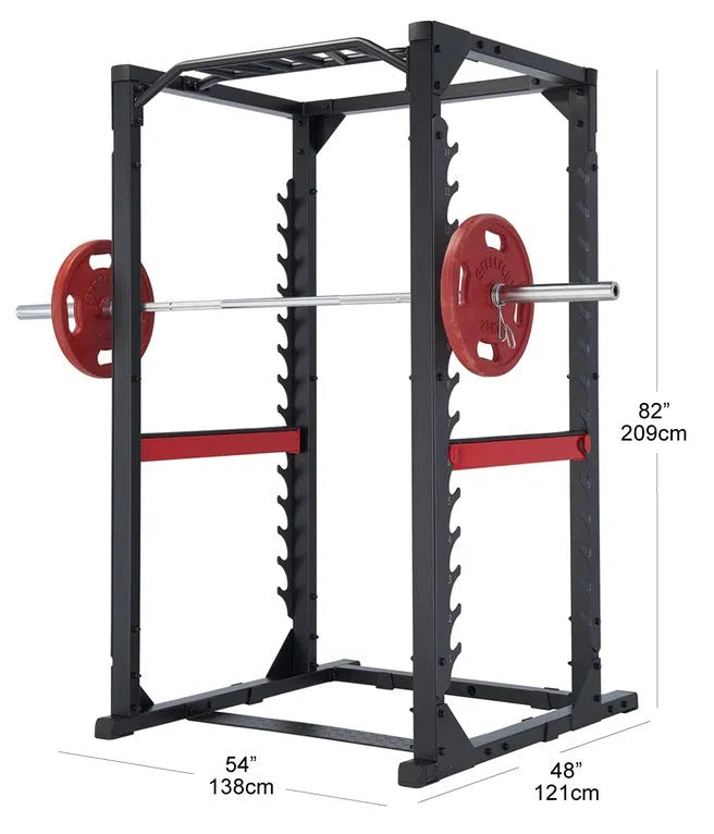 The Steelflex CLPR380 Power Rack boasts a black frame with a chin-up bar and red hooks holding a barbell with red plates. Ideal for strength training, it measures 82 H x 54 W x 48 D.