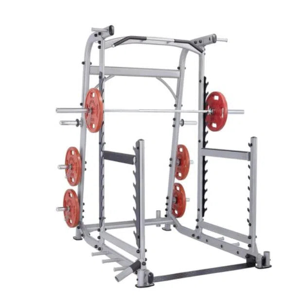 A silver Steelflex Smith machine with red weight plates and a barbell on a guided track is ready for weightlifting. The SteelFlex Squat Rack with Pull-Up Bar enhances your strength training routine.