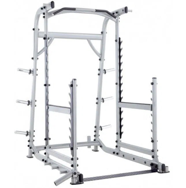 The Steelflex SteelFlex Squat Rack with Pull-Up Bar (NOPR) is a silver Smith machine featuring a pull-up bar, barbell hooks, and plate storage pegs—perfect for weightlifting and strength training in commercial gyms.