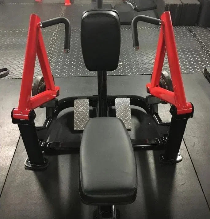 The Steelflex Chest Supported Row Machine (PLSR) features ergonomic design with red and black padding on a dark floor and metal details. Two handles linked to red levers make it ideal for efficient chest and arm muscle workouts.