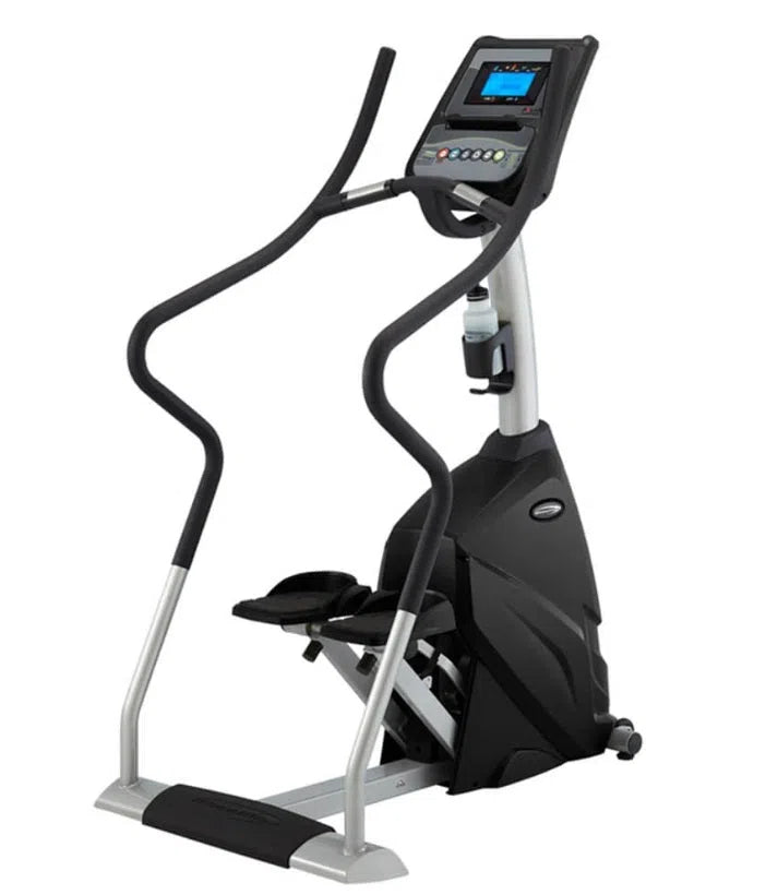 The Steelflex SteelFlex Commercial Stair Climber Machine (PST10) is black and silver and helps you achieve fitness goals with its digital display, control panel, adjustable resistance levels, curved handlebars, pedals for foot placement, compact design, and water bottle holder.