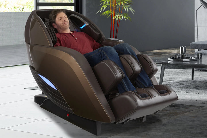 A man relaxing in the Yutaka 4D Full Body Massage Chair M898 brown variant