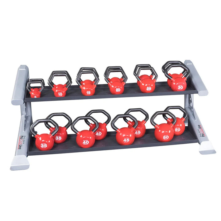 The Body-Solid Pro ClubLine Storage Rack with Kettlebell Tiers has a modular design, holding red kettlebells with black handles ranging from 5 to 50 lbs. Made of heavy gauge steel, each kettlebell is marked in white for easy identification.