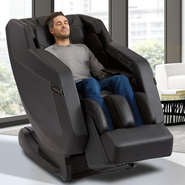 A man relaxing in the Sharper Image Relieve 3D Full Body Massage Chair
