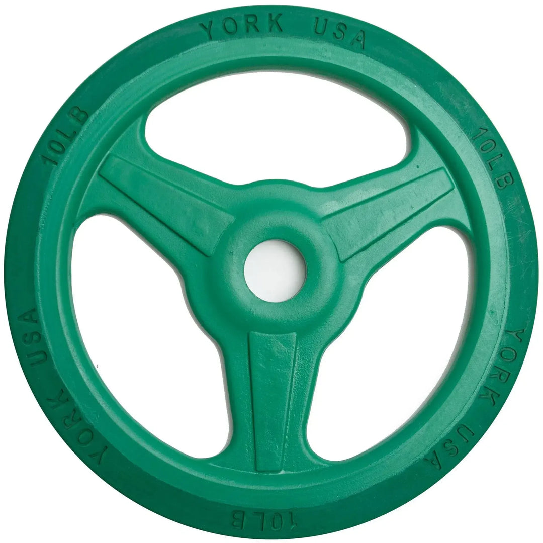 A green 10-pound York Barbell bumper grip plate from the York Bumper Grip Plate Set features a rubber rim, three spokes, and YORK USA label on the edge.