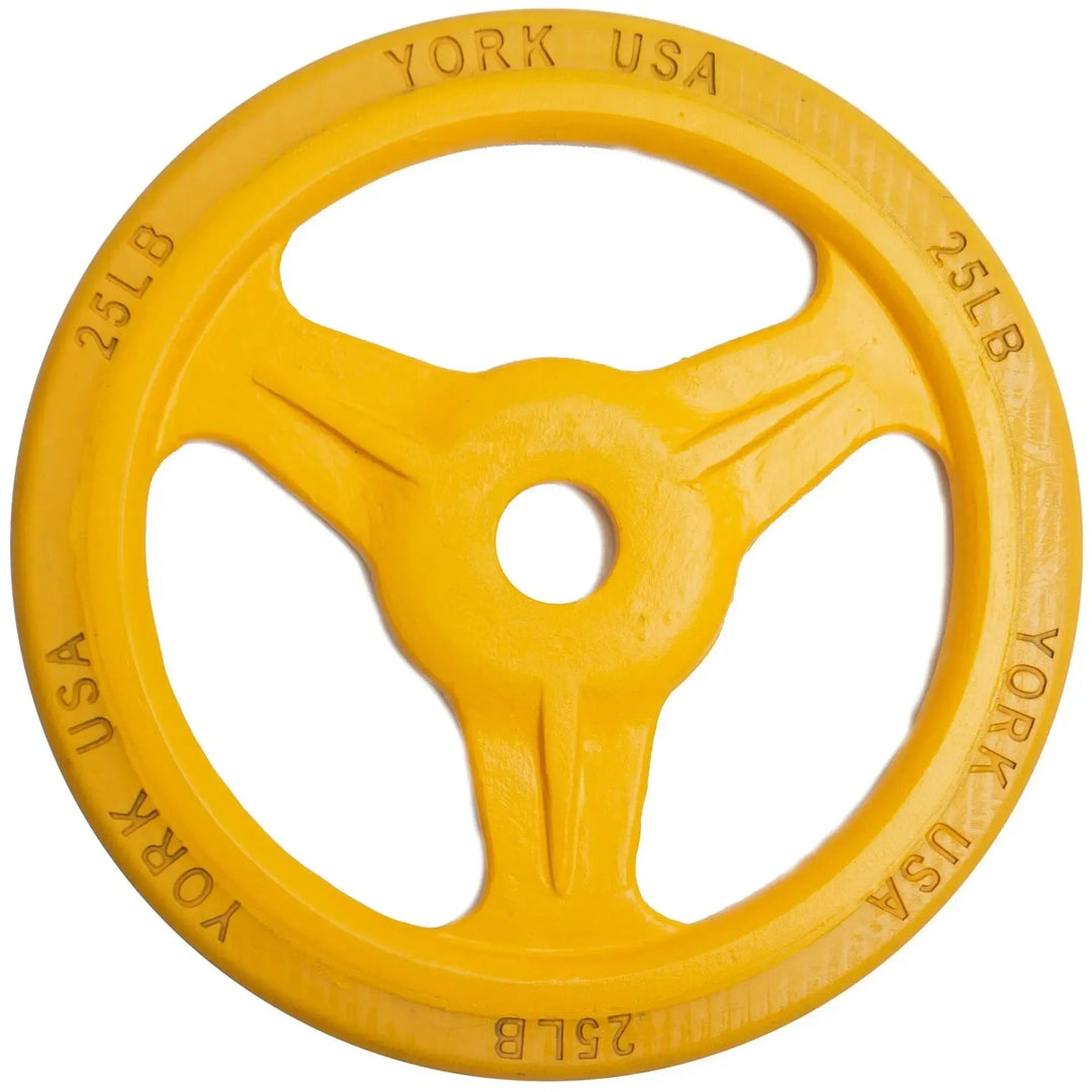The York Bumper Grip Plate Set includes a yellow 25-pound weight plate with three spokes and a rubber rim, embossed with YORK USA and 25LB, perfect for enhancing your York Barbell collection.