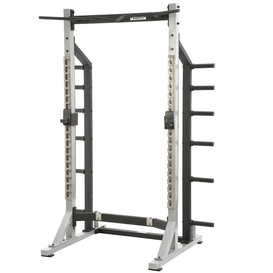 The York Barbell STS Self Standing Half Rack features a sturdy steel frame, pull-up bar, adjustable barbell holders, and side weight storage pegs. Its ideal for strength training with adjustable positions to suit your workout needs.