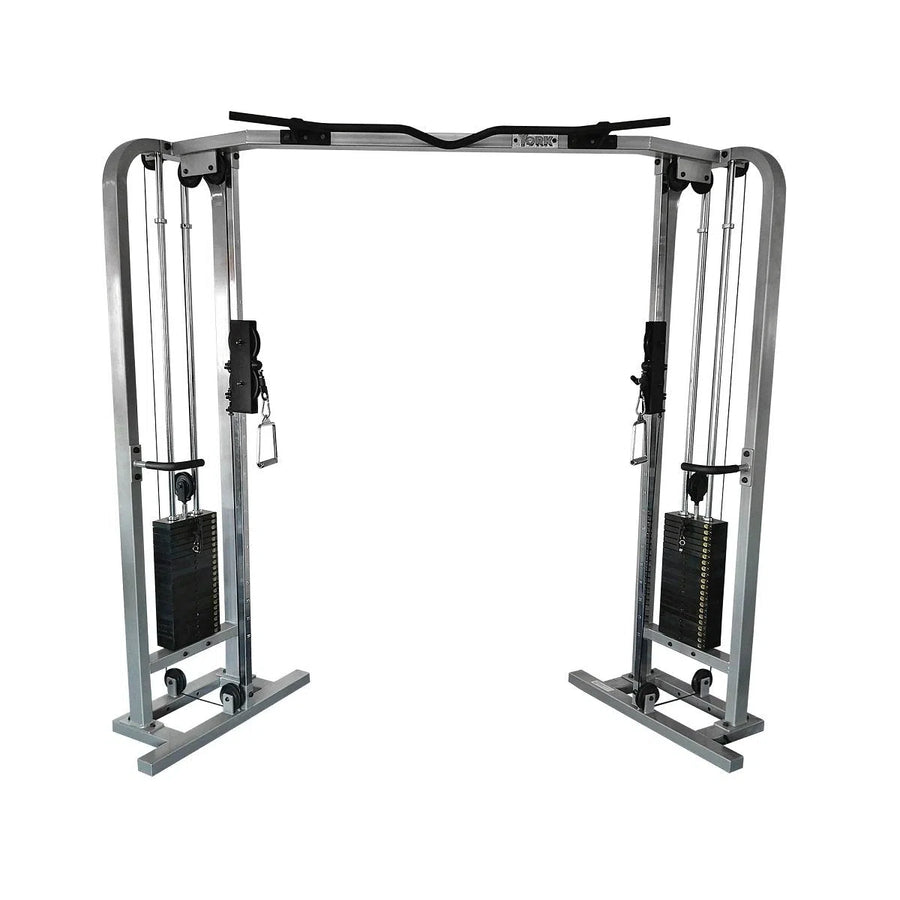 The York Barbell STS Angled Dual Cable Crossover features adjustable pulleys, weight stacks, and a pronated grip chin-up bar. It has two handles per side and a sturdy frame for strength training exercises.