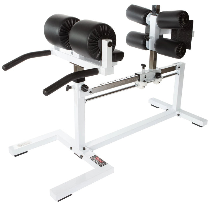 The York STS Glute Ham Developer Machine by York Barbell is a versatile, white hamstring trainer with black padding and adjustable settings. It features front handles, knee pads, and ankle supports for exercises targeting glutes and strengthening the lower back.
