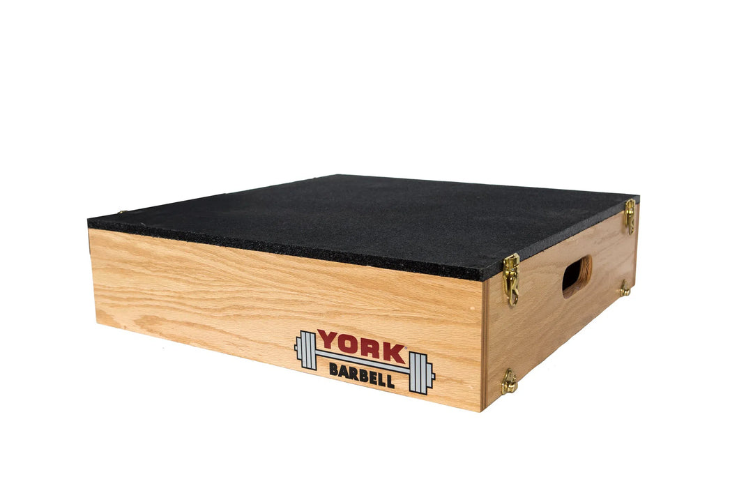 The York Stackable Plyo / Step-Up Box from York Barbell features a black rubber surface, handles for easy carrying, and the York Barbell logo. Ideal for high-intensity workouts and versatile training routines.