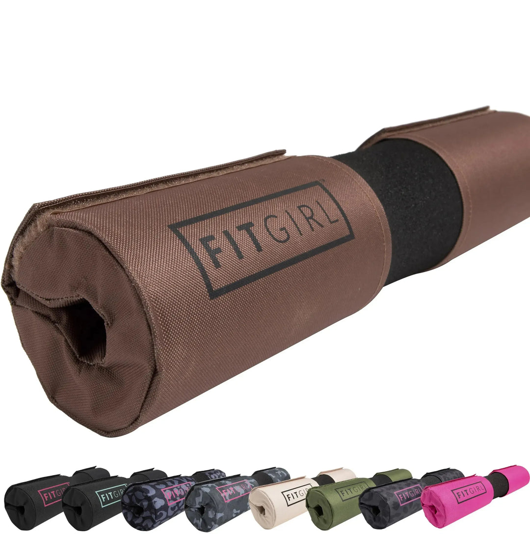 In the foreground, a brown FITGIRL Squat & Hip Thrust Barbell Pad features thick foam cushioning. Below, an array of these barbell pads for women comes in vibrant colors and patterns like black, pink, camouflage, and leopard print.