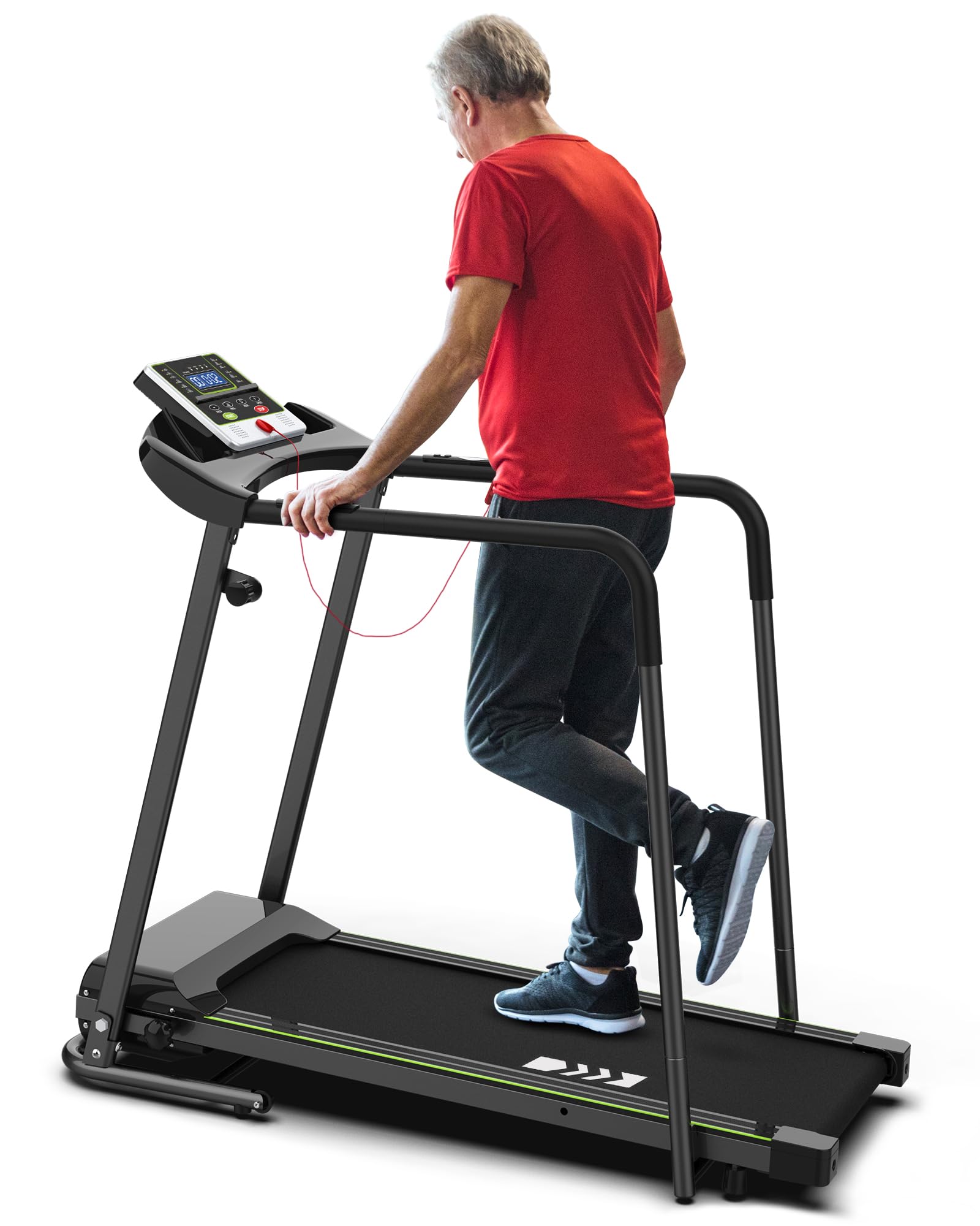 An older man wearing a red shirt and dark pants walks on a treadmill, holding onto the side rails and looking at the control panel in front of him.