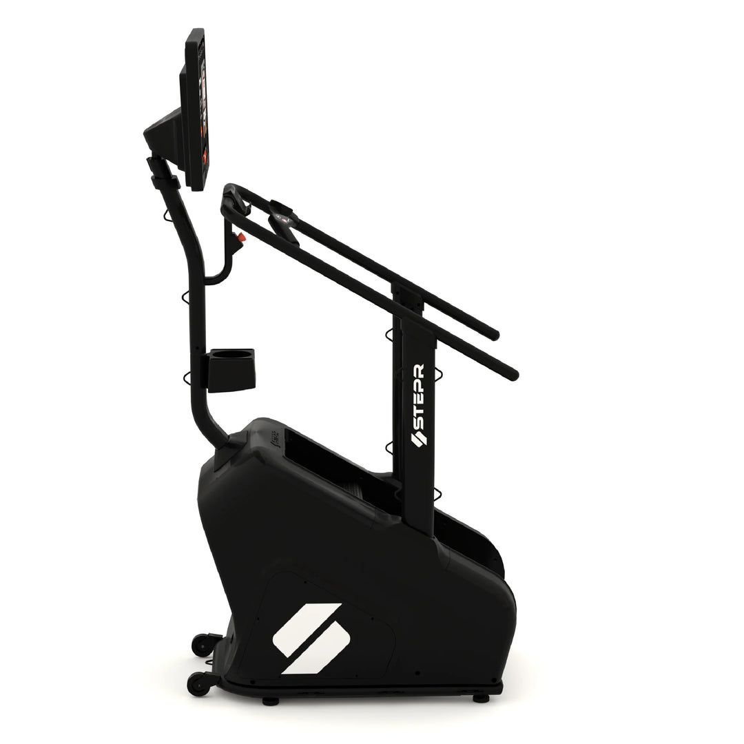 A black commercial stepper machine with a digital display, handlebars, and a small water bottle holder. The brand logo Stepper is visible on the side. The design is modern and compact.