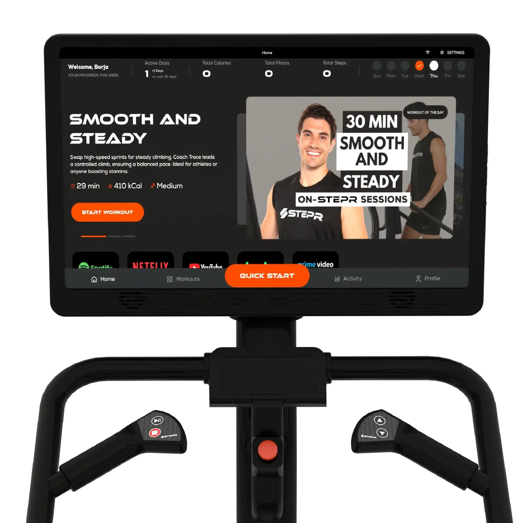 A fitness monitor displays an exercise video titled Smooth and Steady featuring a smiling instructor. The session is 28 minutes long, burns 410 calories, and is medium intensity. The screen includes workout and navigation options.