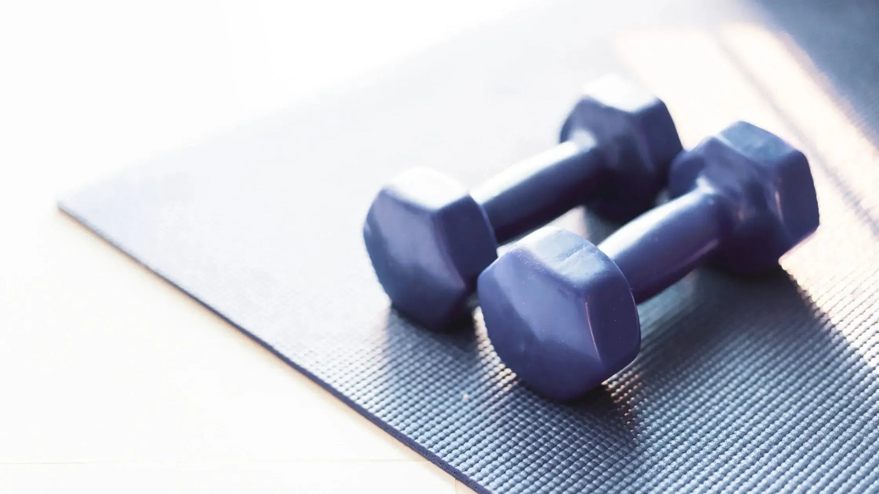 Dumbbells on mat
