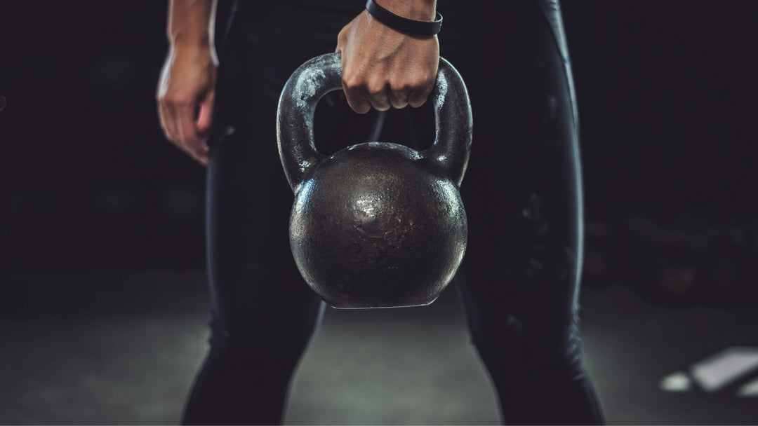Person holding kettlebell feature image