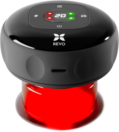 The REVO 4-in-1 smart cupping massager held against skin, with red light visible through the cup and three detachable cup heads beside it.