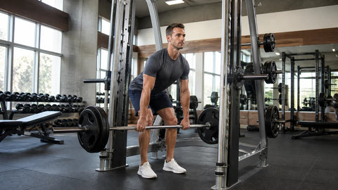 Man performing a Smith machine Romanian deadlift with a neutral spine