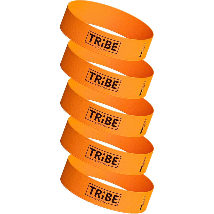 Six vibrant orange Tribe Fabric Resistance Bands for Booty Workout are stacked vertically, each featuring the sleek black Tribe logo. These versatile bands are perfect for enhancing your exercise and fitness routine.