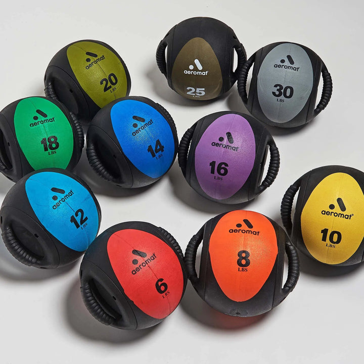 colorfull set of Aeromat Medicine Balls in 6, 8, 10, 12, 14, 16, 18, 20, 25, 30 lbs. shown together.